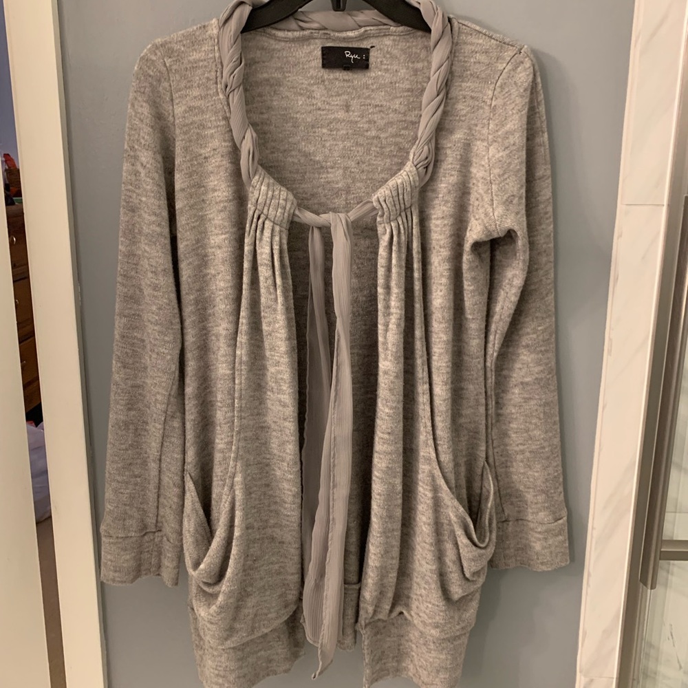 Light grey tie front sweater with pockets.